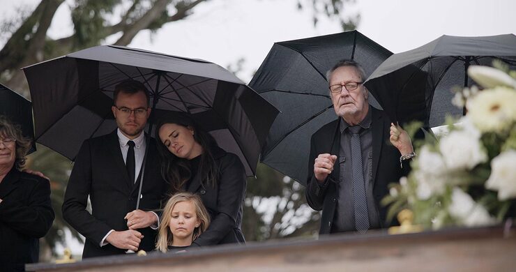 death-funeral-umbrella-people-coffin