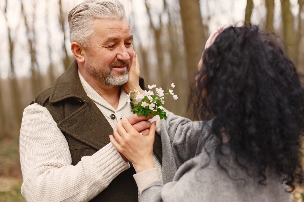 Elegant adult couple in a spring forest